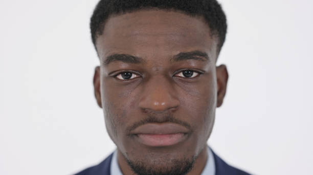 Serious Face of African American Businessman on White Background
